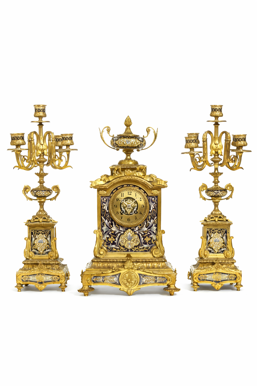 A French gilt bronze and champlevé enamel clock garniture