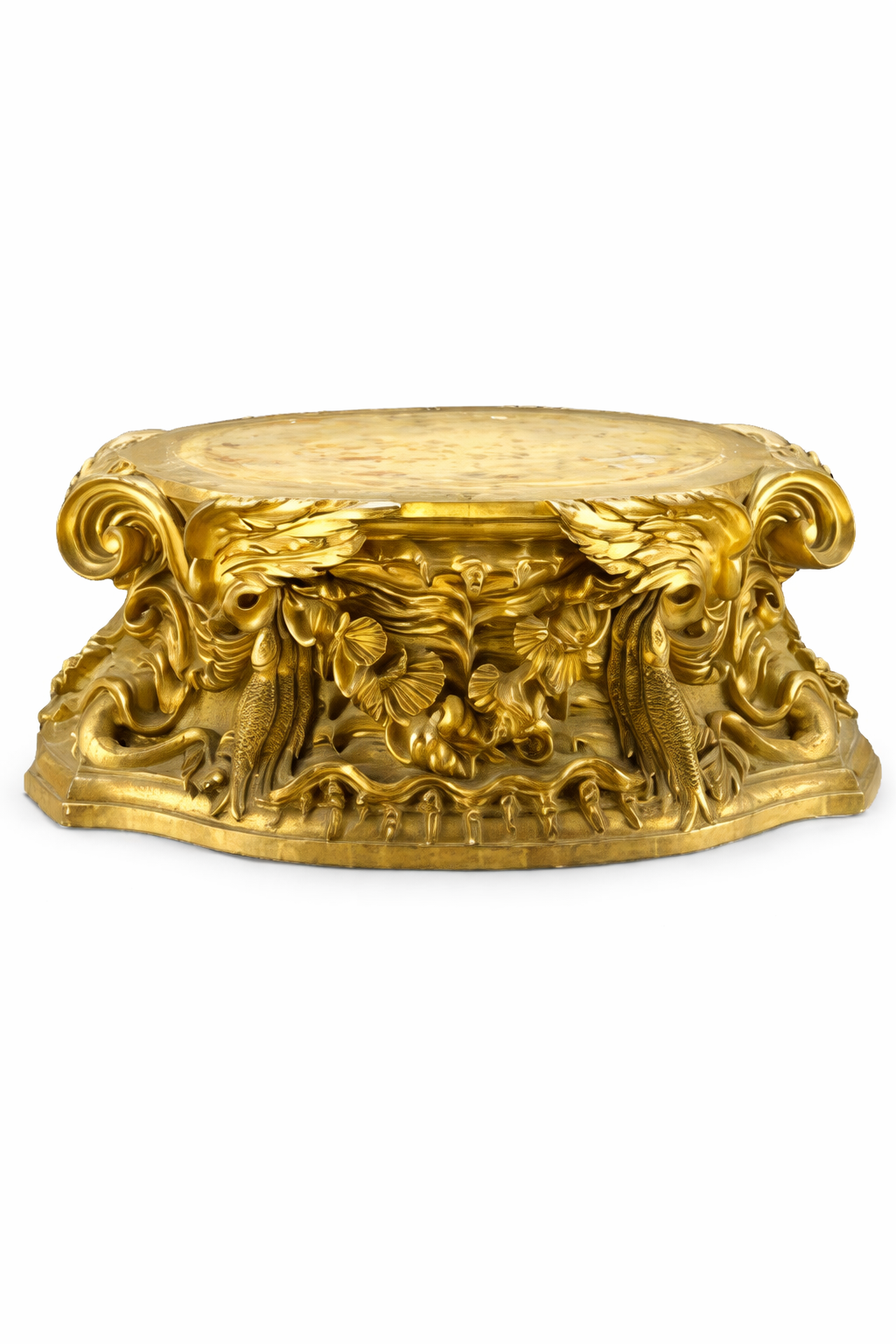 A carved giltwood plinth of shaped outline with outstepped corners