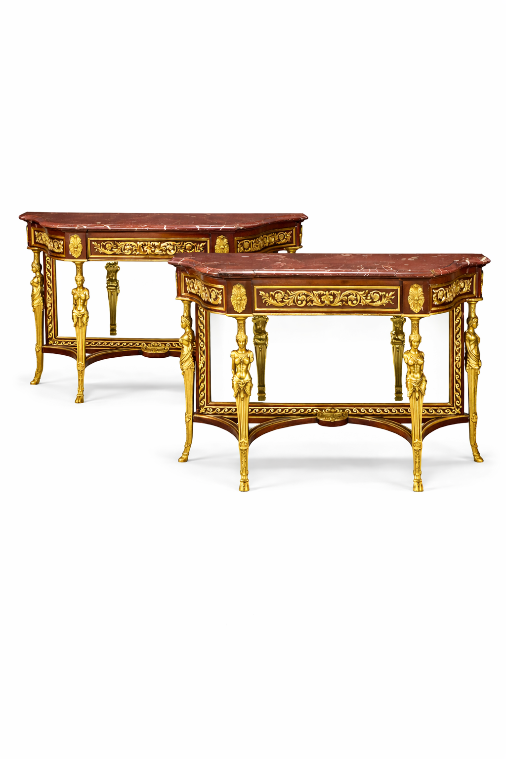 A pair of Louis XVI style gilt bronze mounted mahogany consoles
