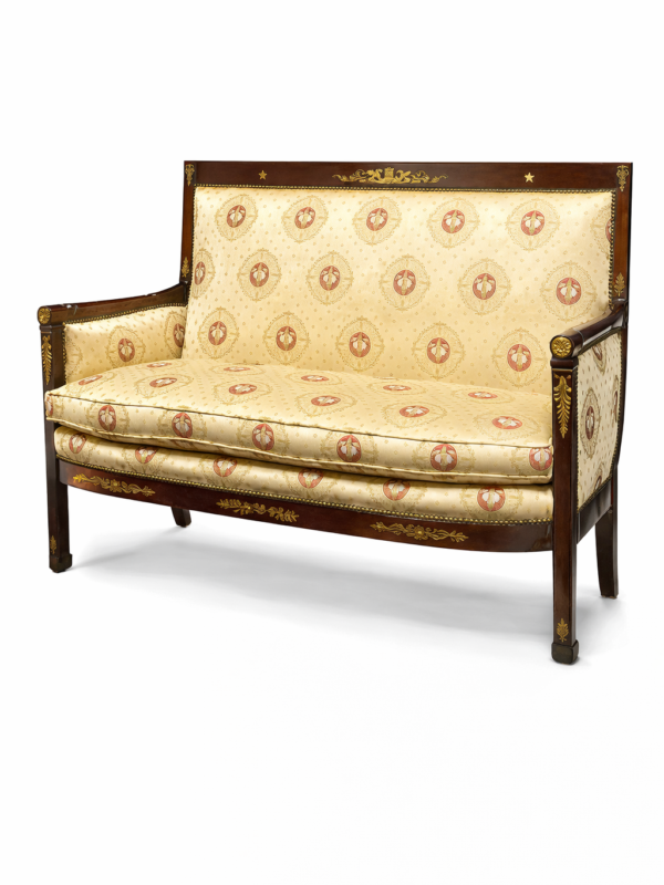French Empire style gilt bronze mounted mahogany canapé with fully upholstered back, sides and banquet seat.