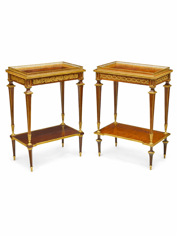 Henri Dasson signed and dated 1892 Two very similar good quality Louis XVI style gilt bronze mounted mahogany two tier tables with a drawe.