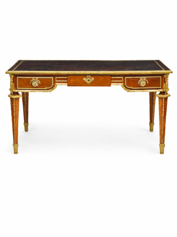 A Louis XVI style gilt bronze mounted parquetry inlaid mahogany bureau plat, circa 1920