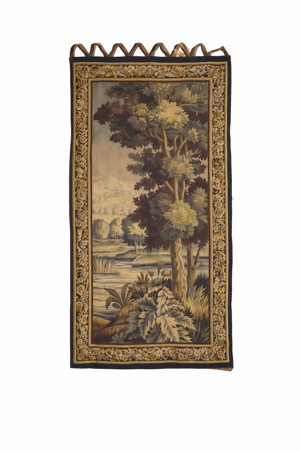 Aubusson verdure tapestry,circa 1850 unsigned.depicting a forest interior enclosed in a foliate border